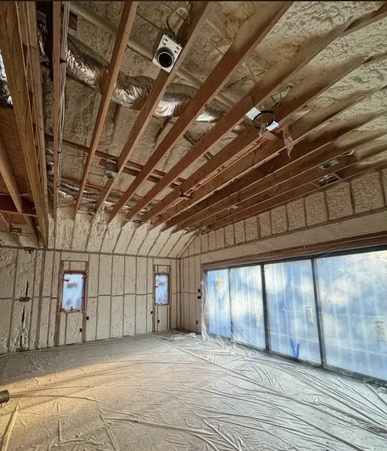 Interior walls and ceiling insulated with spray foam during new construction in Dearborn